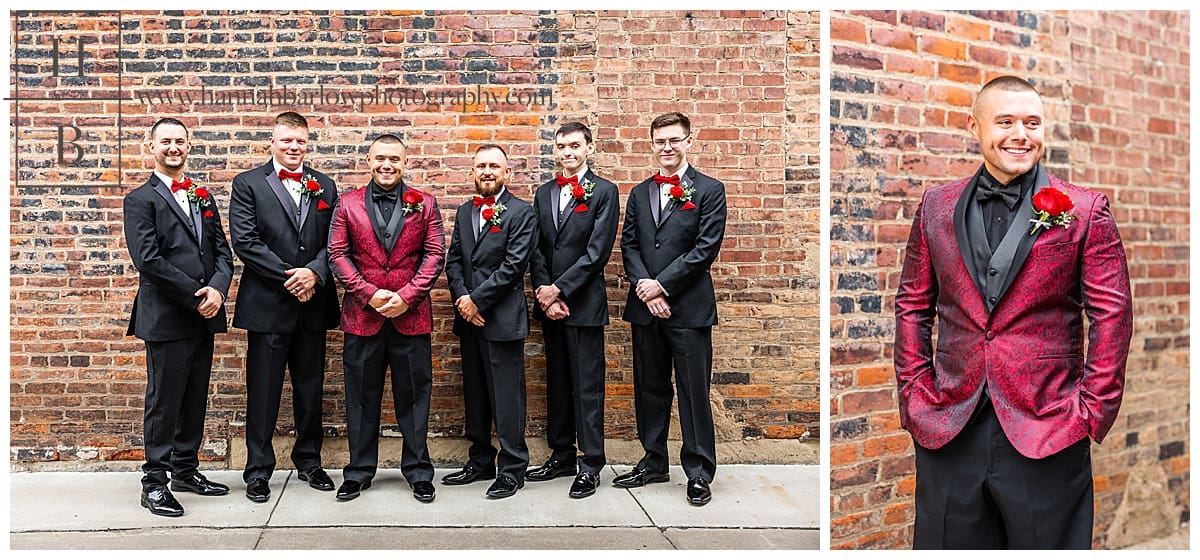 groom in red jackets poses with men in black tuxes