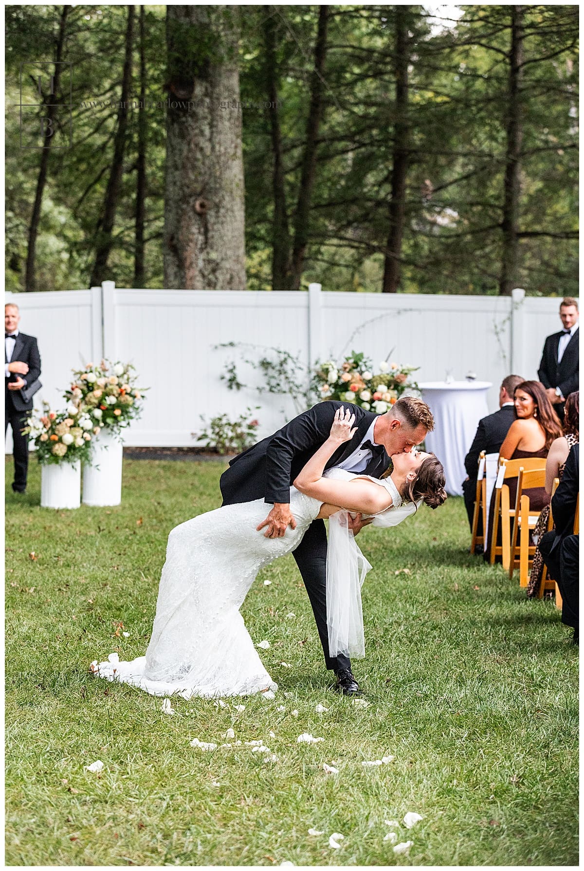 groom dips bride at end of aisle after getting married at Ellis House in fairmont wv