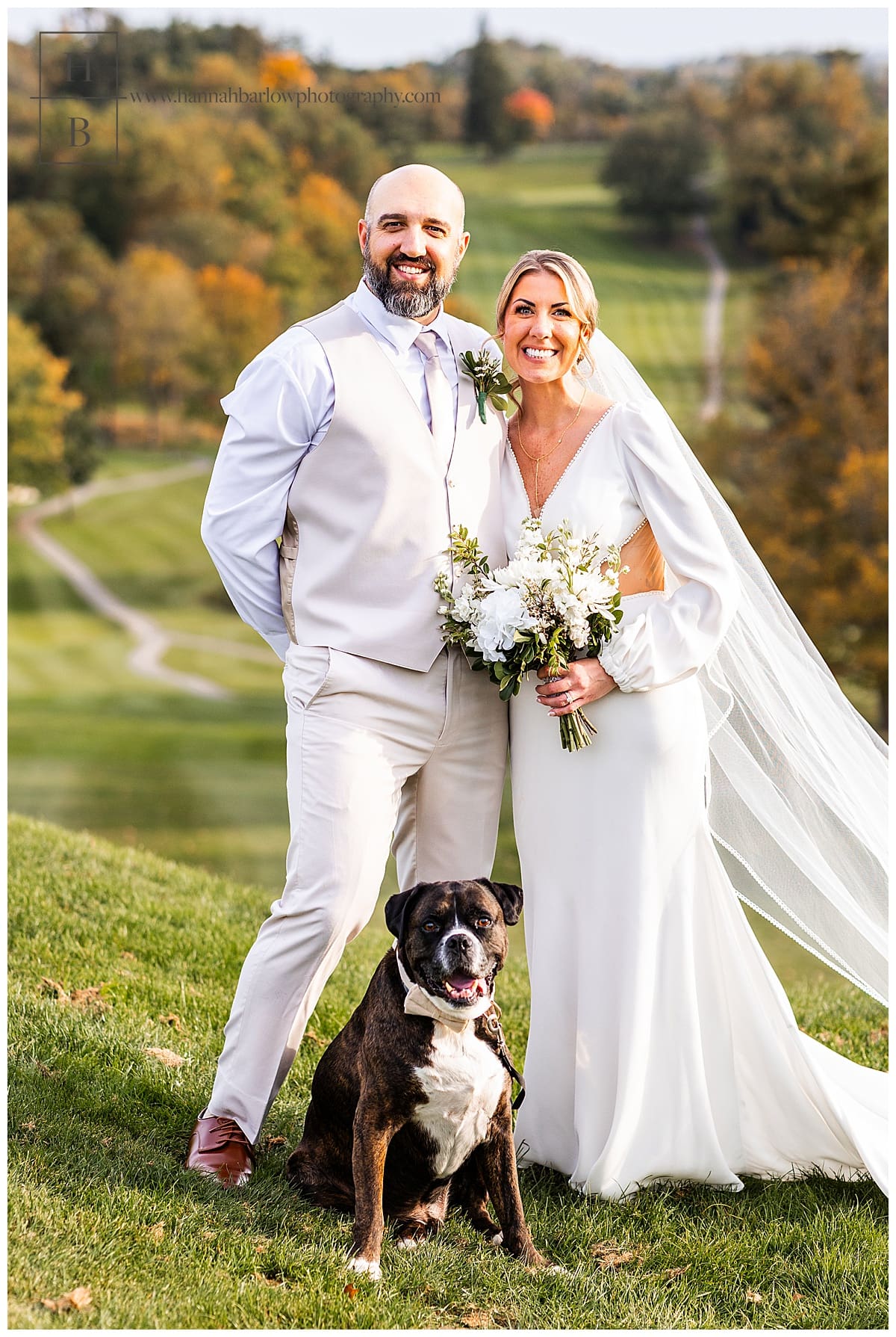 bride and groom pose with dog