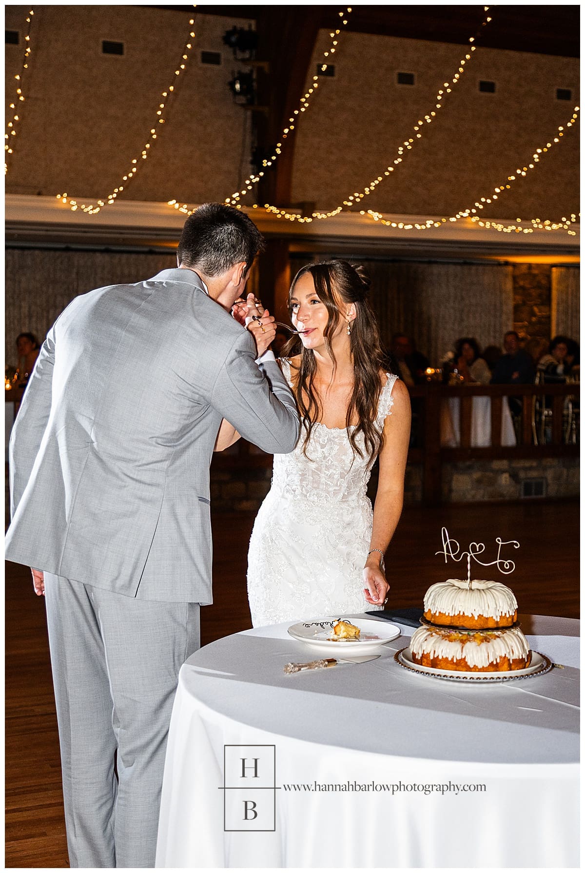 bride and groom eat cake